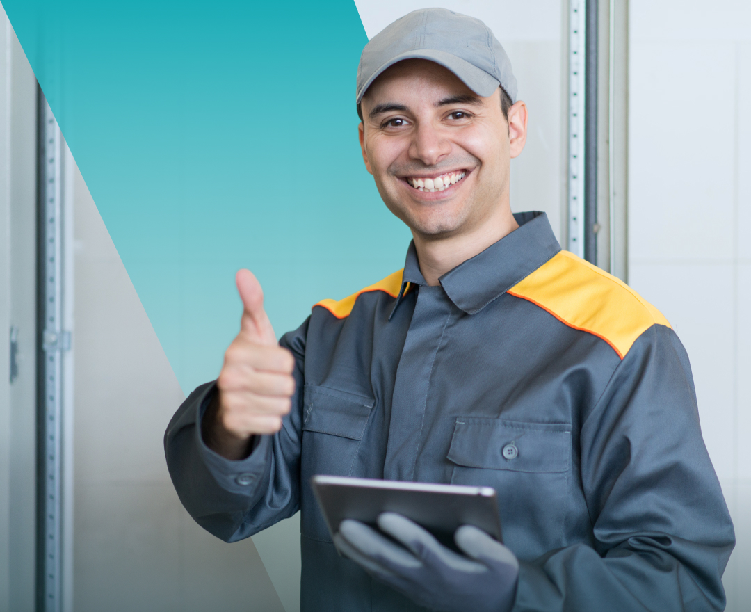 Smiling Solavita technician giving thumbs-up while holding tablet for solar system inspection