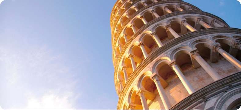 The Leaning Tower of Pisa under warm sunset light in Italy